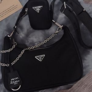 Small Prada purse, Black,with small side clutch.